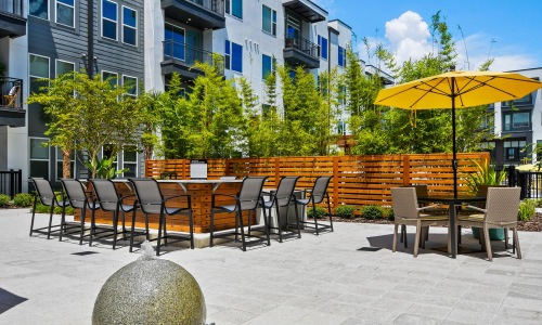 a patio with tables and chairs