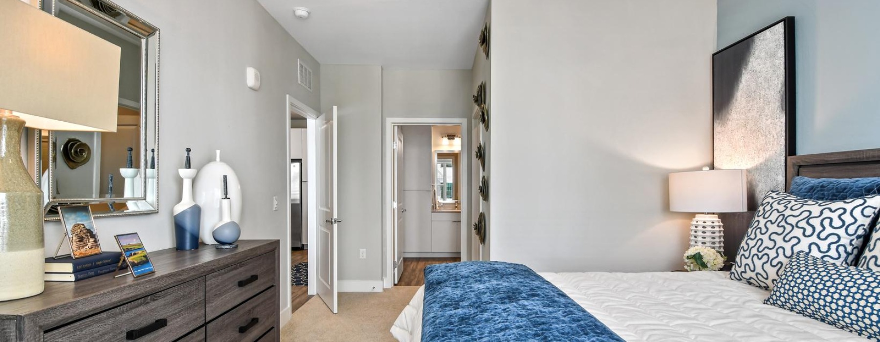 a bedroom with a bed and a dresser