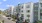 a building with cars parked in front