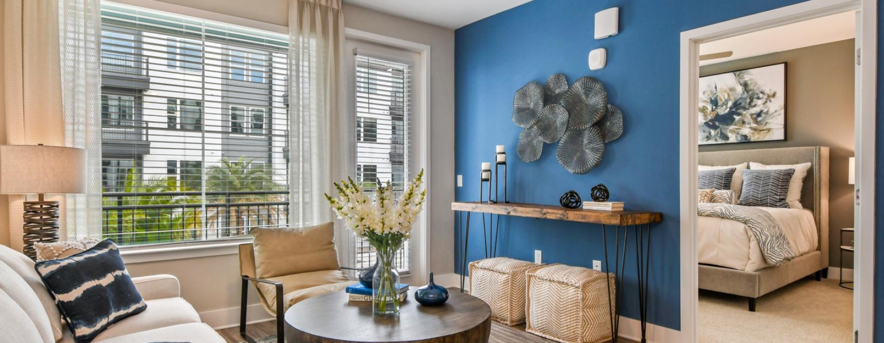 a living room with a blue wall