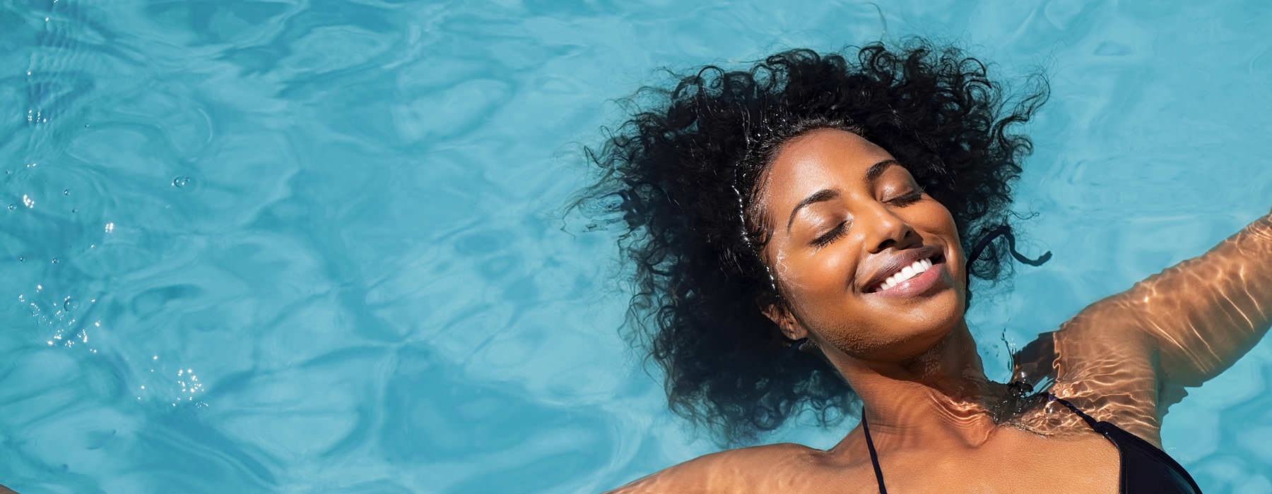 a woman in a swimsuit in the water