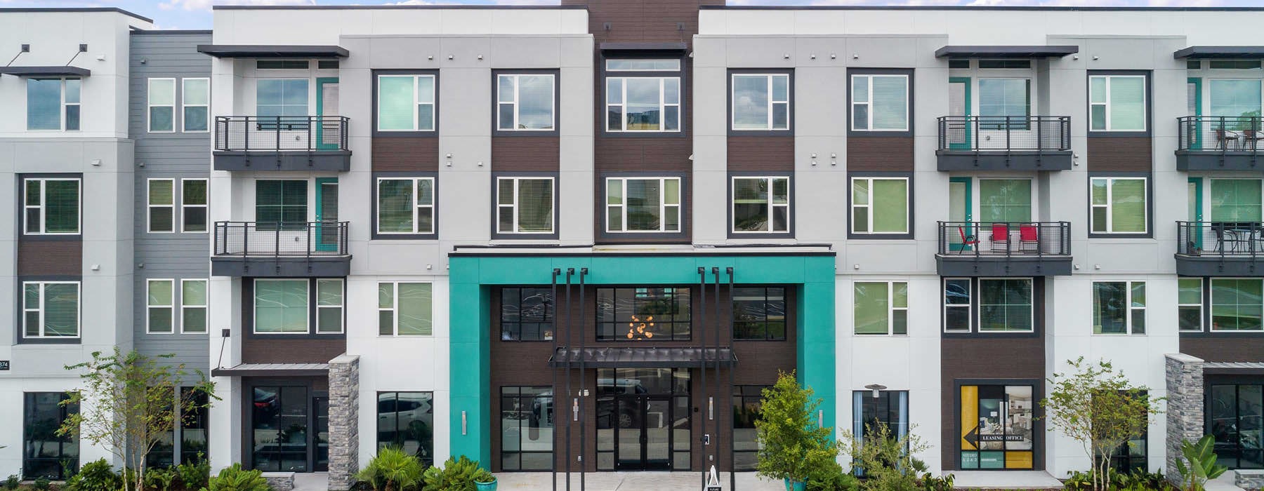 a building with cars parked in front