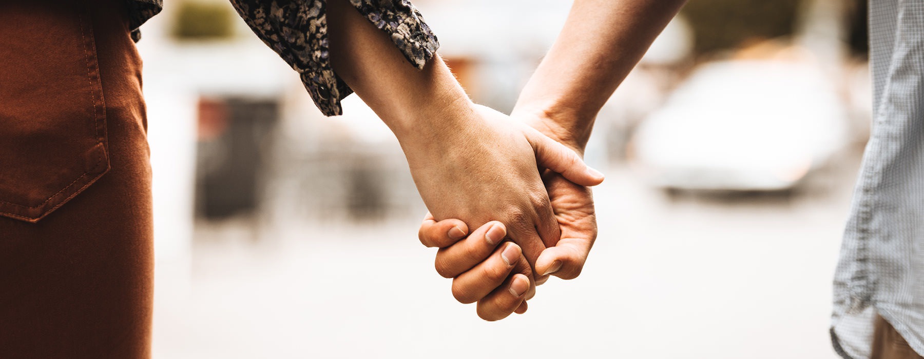 a close-up of people holding hands