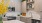 a kitchen with a stove and shelves