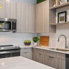 a kitchen with a stove and shelves