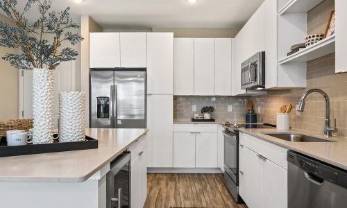 a kitchen with white cabinets