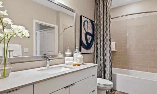 a bathroom with a tub sink and toilet