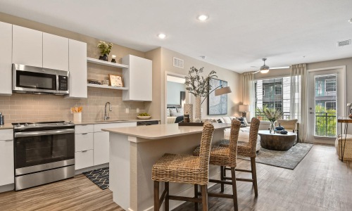 a kitchen with a dining table and chairs