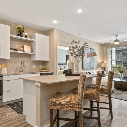 a kitchen with a dining table and chairs