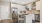 a kitchen with white cabinets